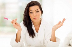 image of a woman showing a pregnancy testing kit at Asanda Abortion Clinic In Durban
