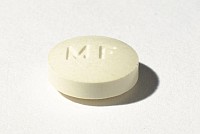 image of round yellowish abortion pill at Asanda Abortion Clinic